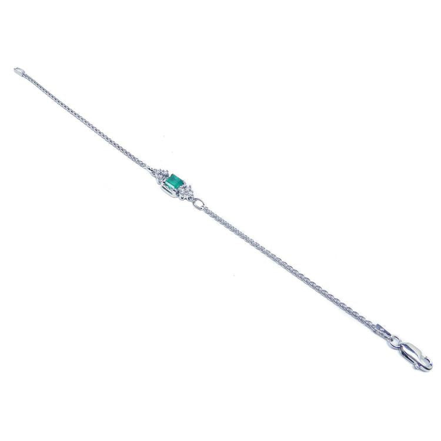 14K white gold bracelet with a central emerald-cut Colombian emerald and diamond accents.