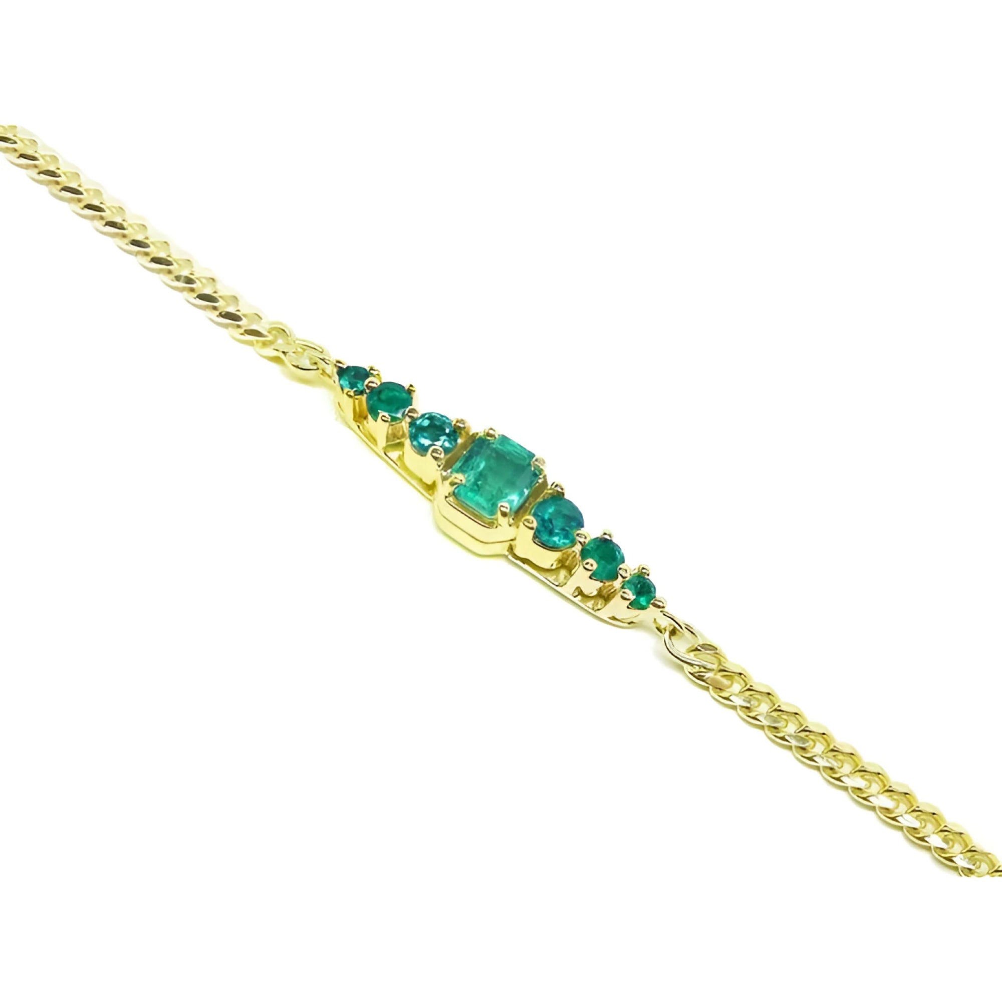 Women's 14K yellow gold bracelet with a central emerald-cut Colombian emerald and smaller round emeralds.
