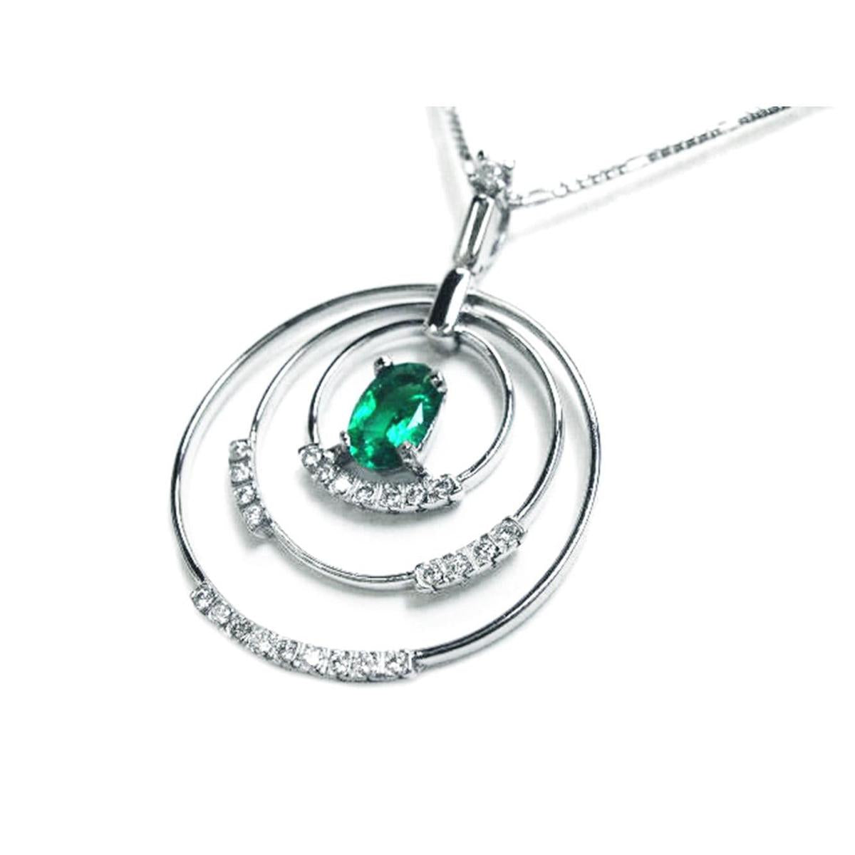 The right-side position of t this triple circle of life emerald pendant shows a closer view of the three rings.