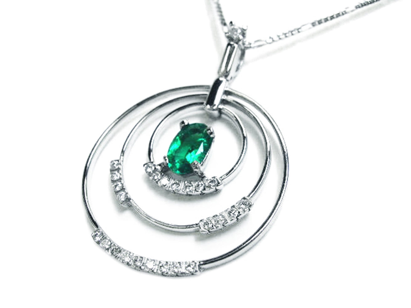The right-side position of t this triple circle of life emerald pendant shows a closer view of the three rings.