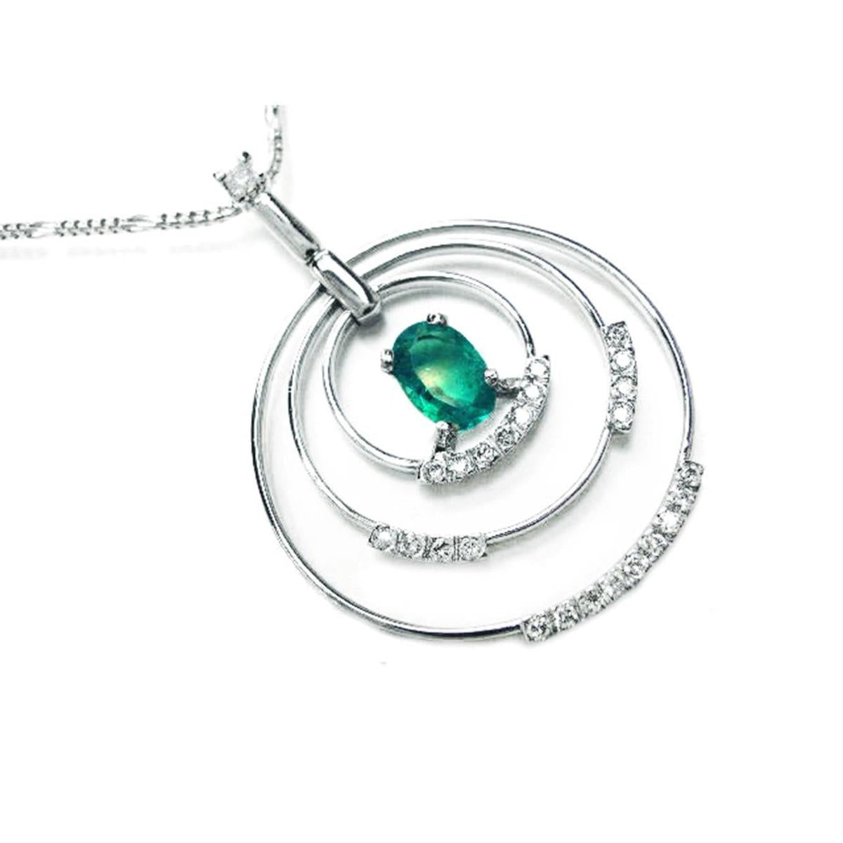 The right-side profile view of this circle of life emerald pendant oval cut with natural diamonds in white gold, clearly shows its three circles.
