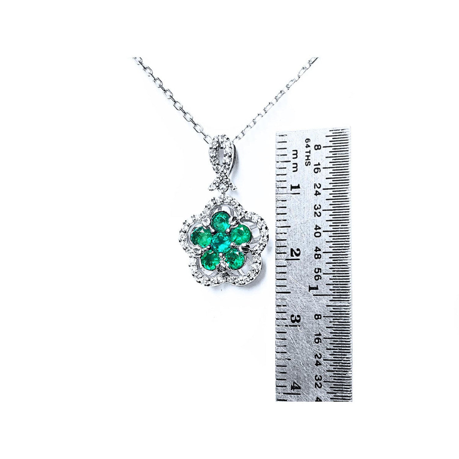 14K white gold emerald and diamond cluster necklace, clover-like five-petal design.