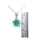 14K white gold emerald and diamond cluster necklace, clover-like five-petal design.