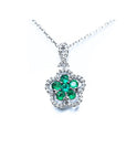 14K white gold emerald cluster necklace with five petals, surrounded by diamonds.