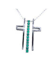 14K white gold cross pendant with a vertical row of round-cut Colombian emeralds on a delicate chain.