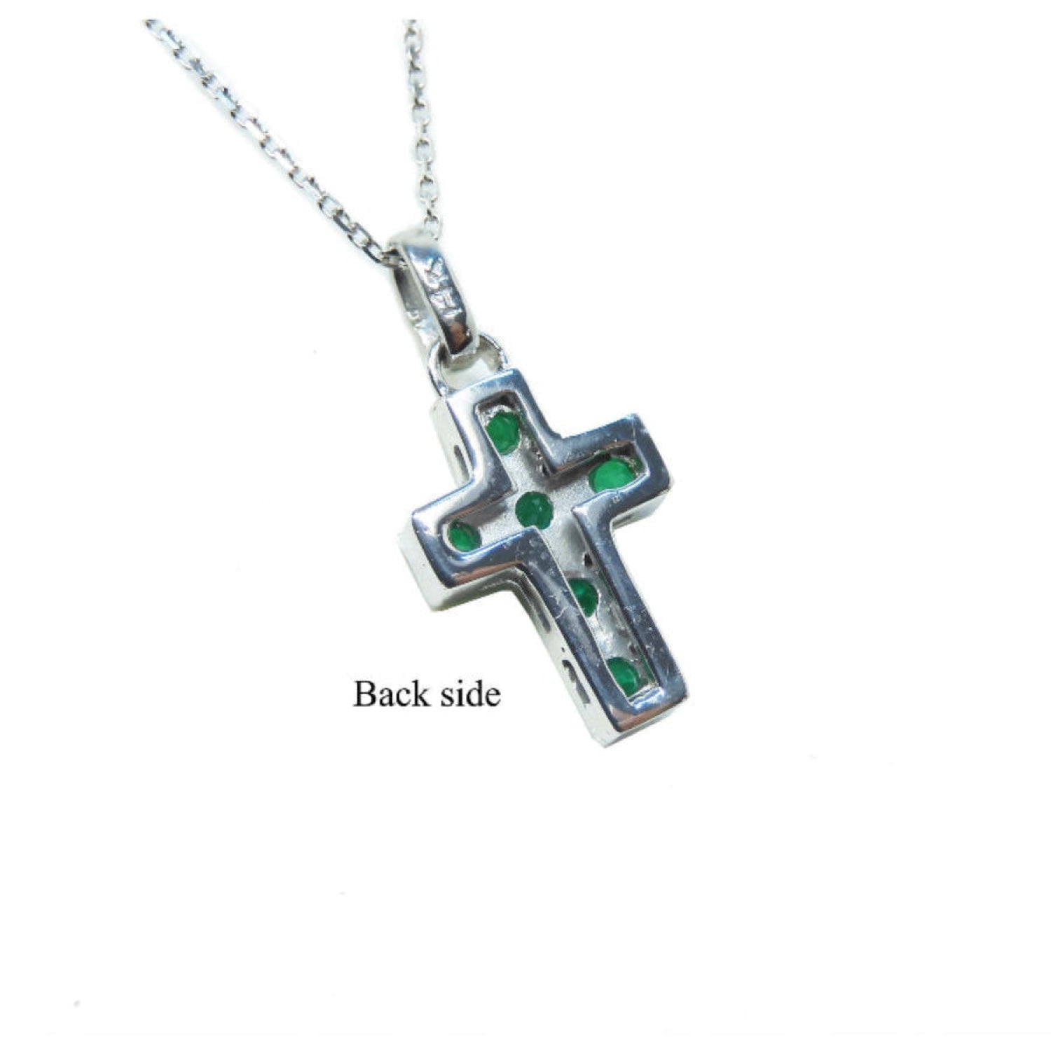 Emerald cross pendant necklace o the back side view.