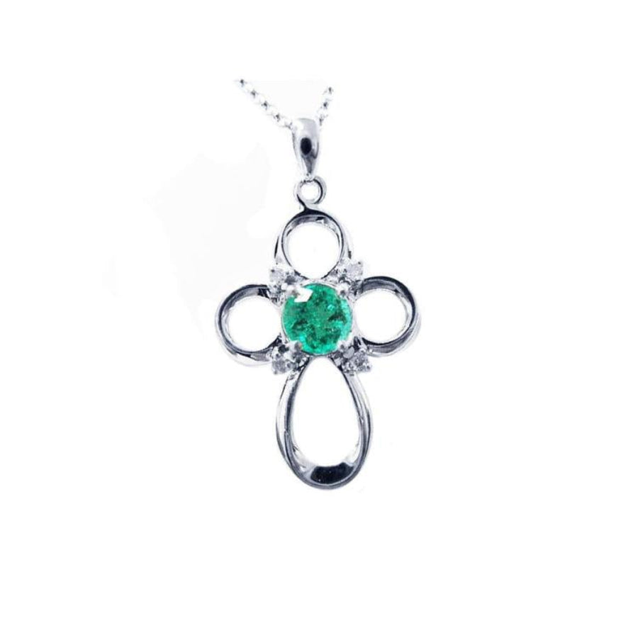 Colombian emerald cross pendant necklace round cut prong set in a 14k white gold mounting.