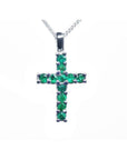 18K white gold cross pendant necklace with 0.55 ct. round-cut emeralds, prong set on a delicate chain.