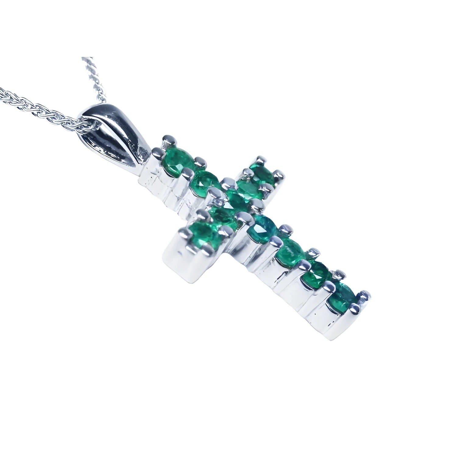 An emerald cross pendant necklace with round cut Colombian emeralds, set in 18k white gold.