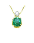 Vibrant 3.43 ct. cushion-cut emerald pendant in 18K yellow gold with a diamond accent.
