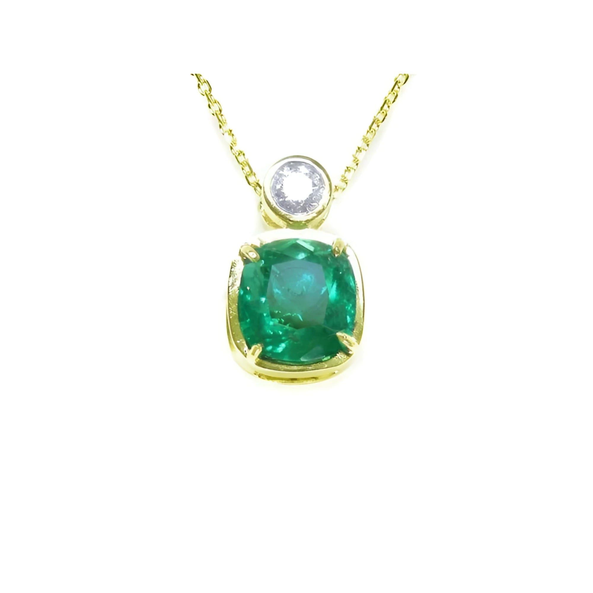 Vibrant 3.43 ct. cushion-cut emerald pendant in 18K yellow gold with a diamond accent.