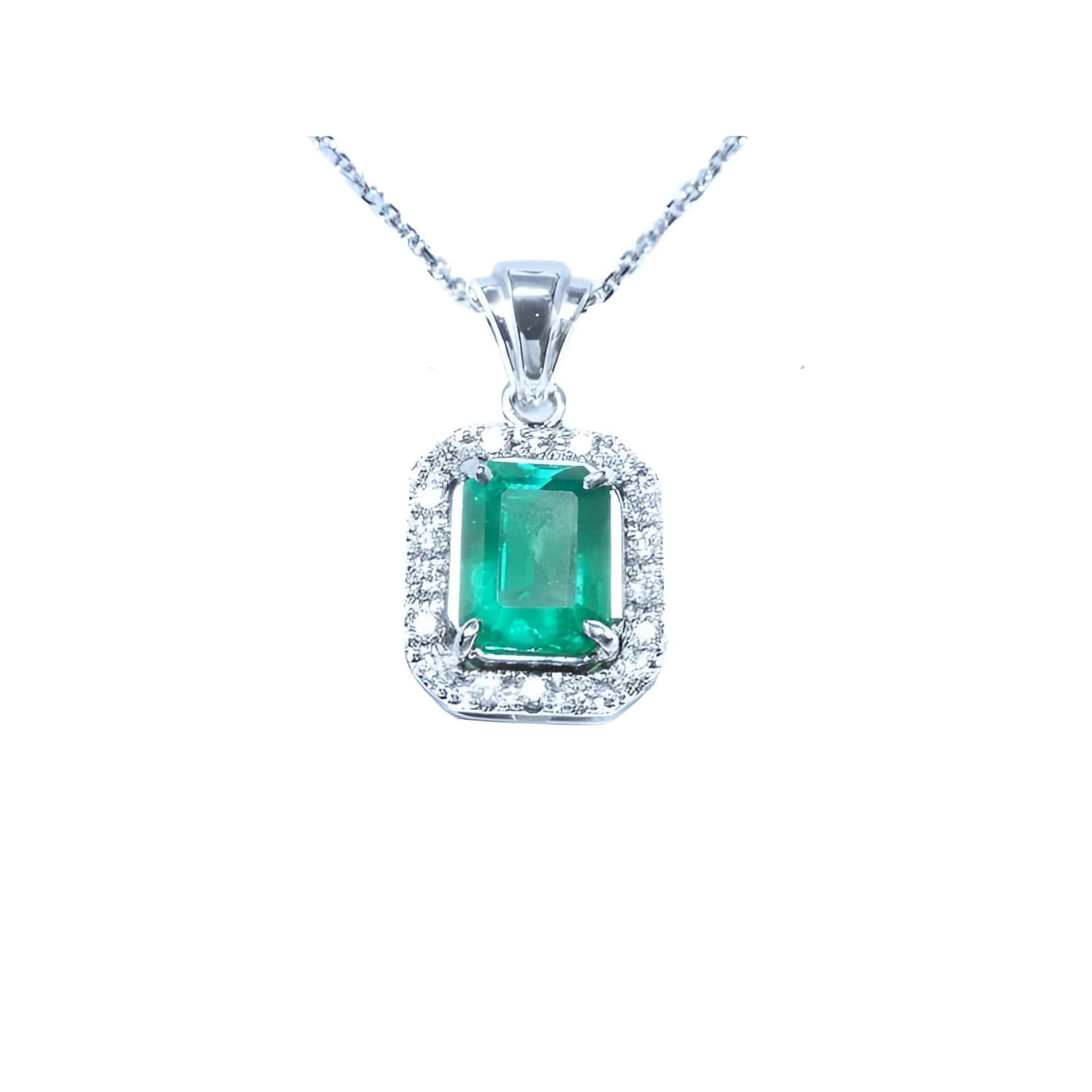 Emerald-cut emerald pendant with halo diamonds in 14K white gold on a chain.