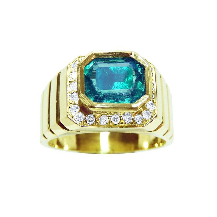 Front position top view of an emerald-cut men's emerald ring bezel set crafted in 18k yellow gold.