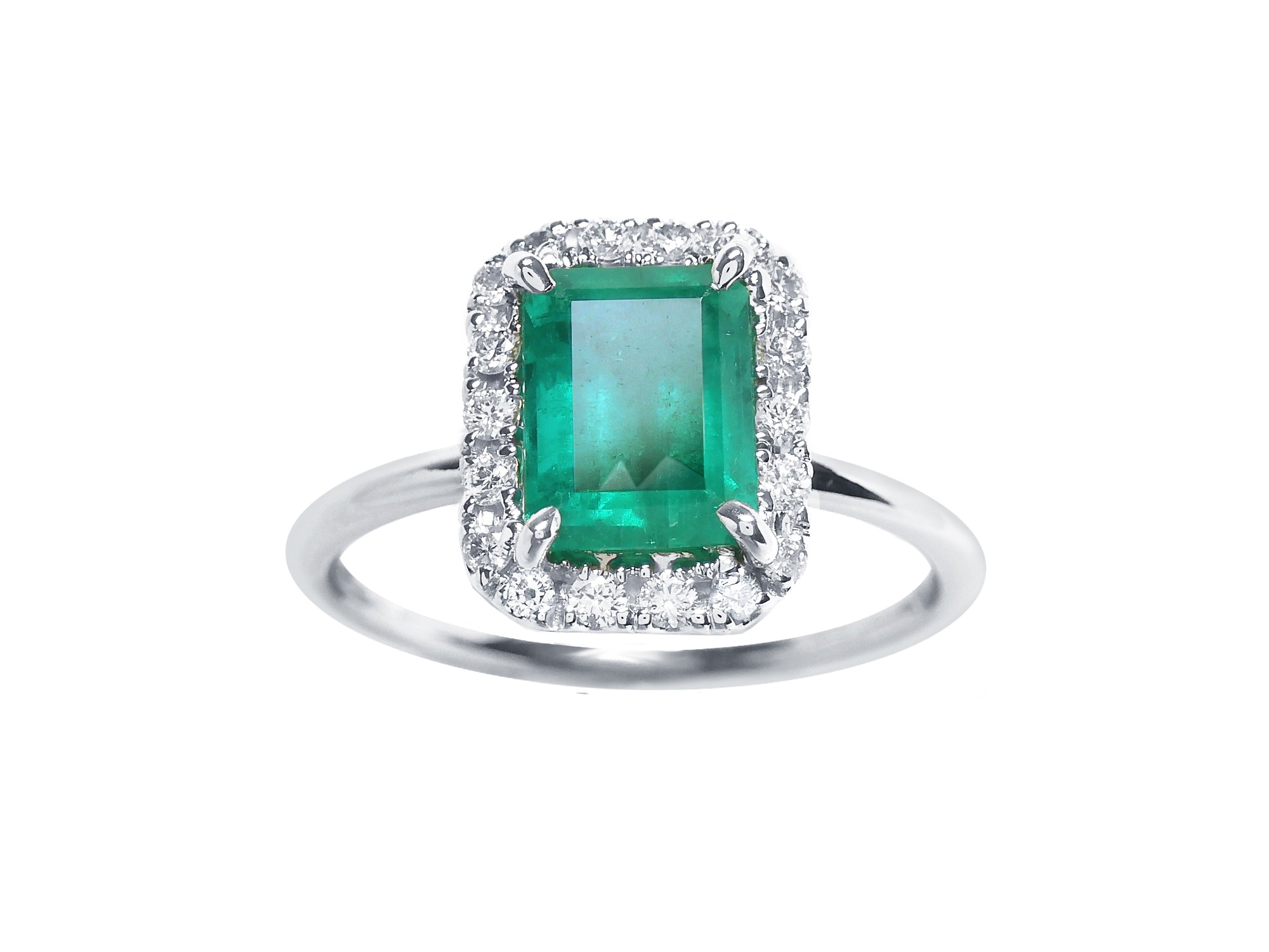A rectangular emerald-cut encircled by a halo diamond emerald ring in 1k white gold topside view.