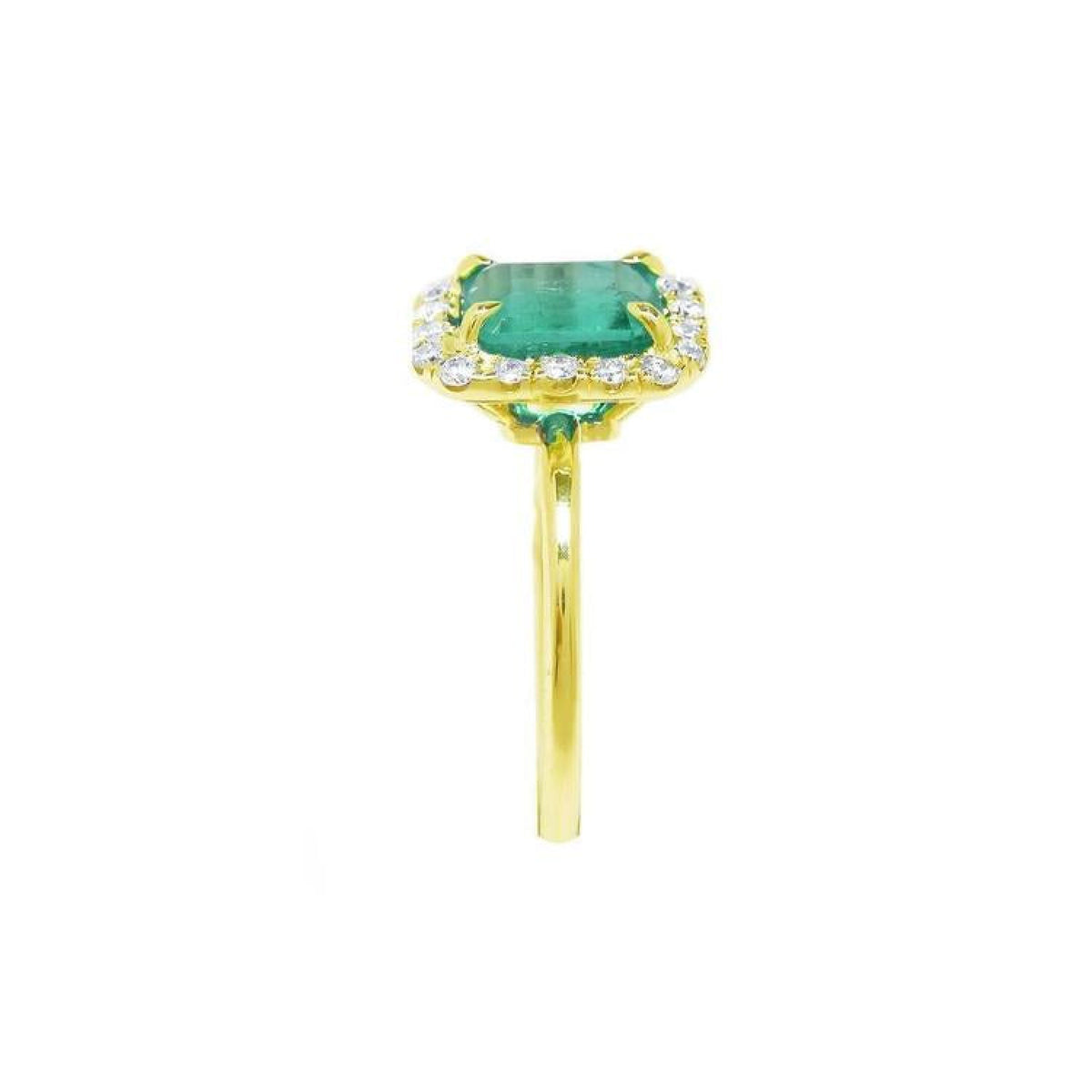 1.69 ct emerald-cut Colombian emerald halo diamond ring in 14K yellow gold.