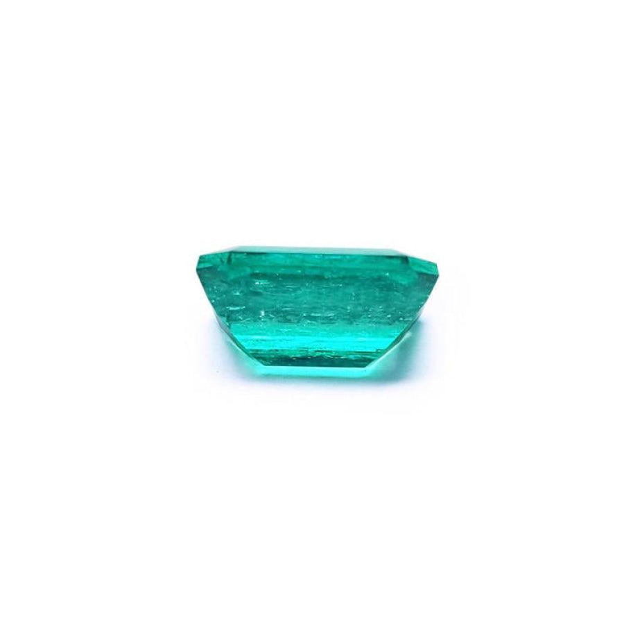 4.18 carat emerald-cut loose Colombian emerald with vibrant bluish-green color.
