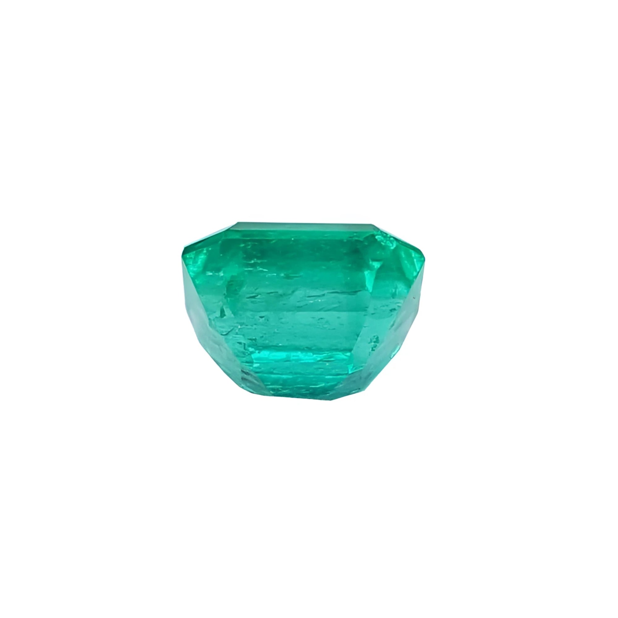 1.55 carat emerald-cut Muzo Colombian loose emerald, sparkling medium bluish green.