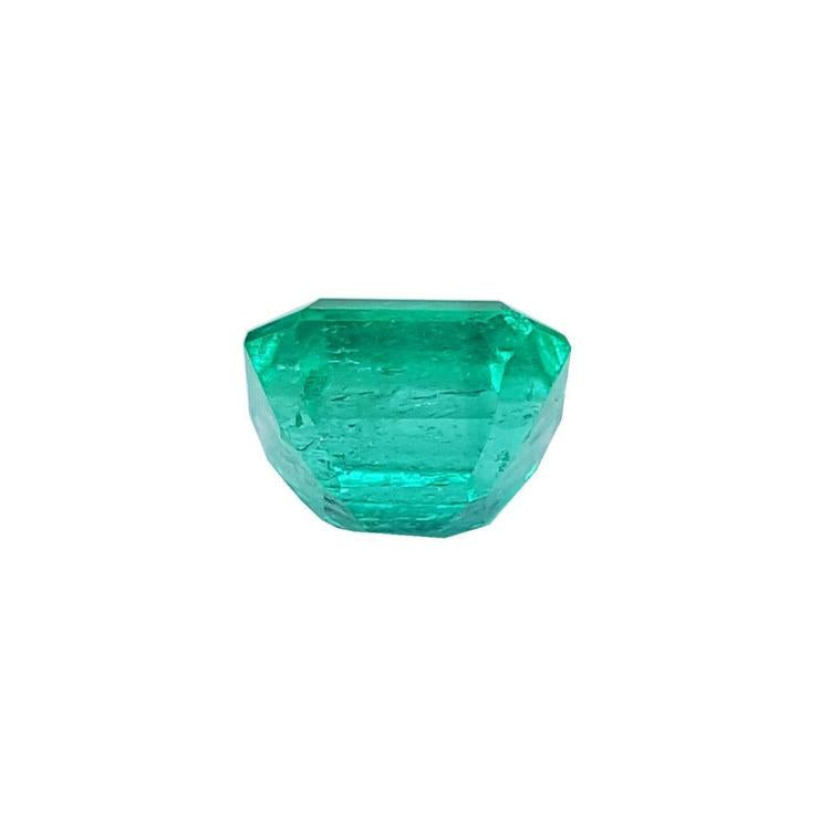 1.55 carat emerald-cut Muzo Colombian loose emerald, sparkling medium bluish green.