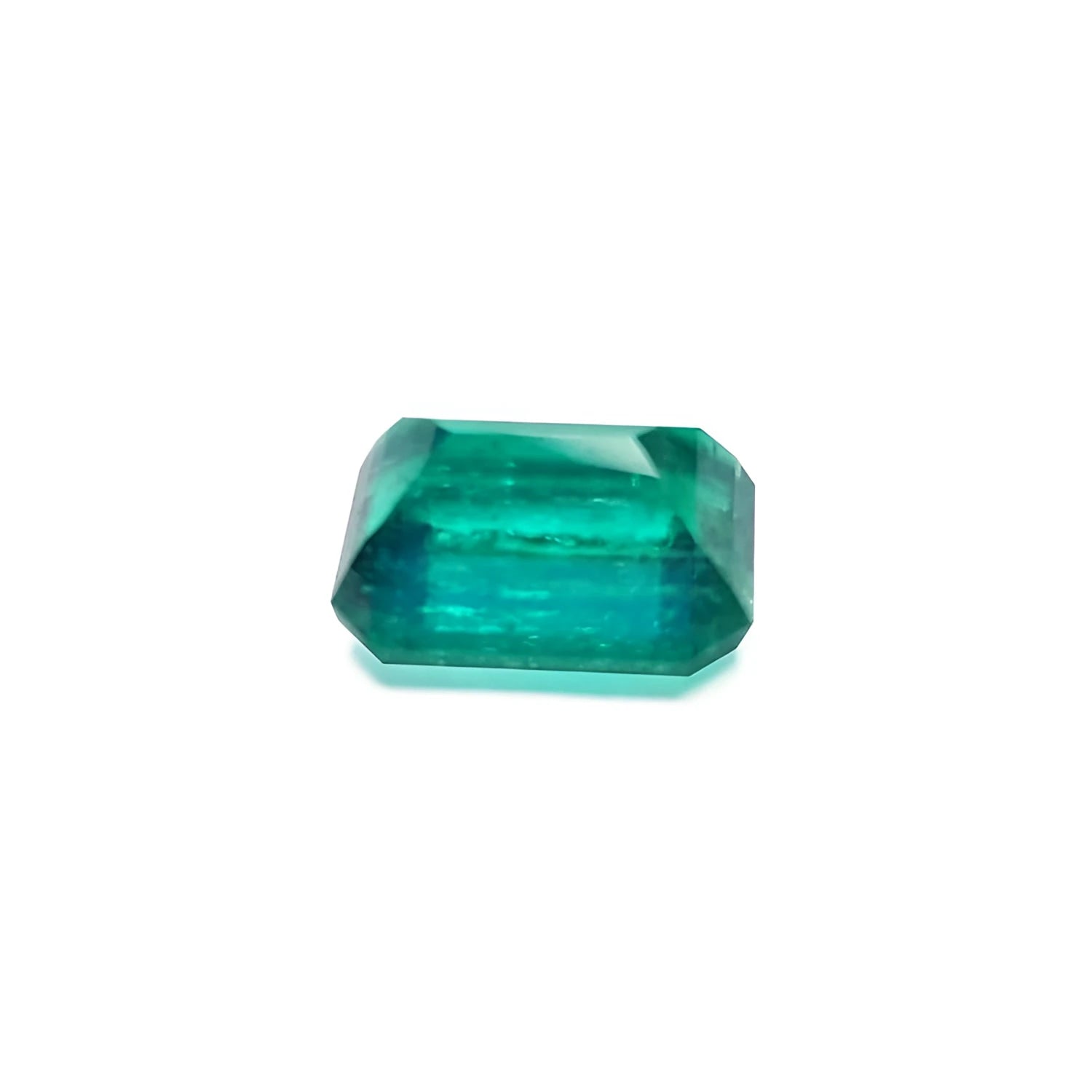 Vibrant bluish-green 4.18 carat emerald-cut loose emerald from Muzo, Colombia.