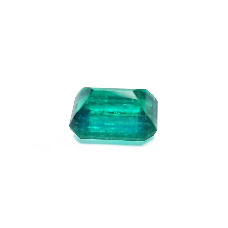 Vibrant bluish-green 4.18 carat emerald-cut loose emerald from Muzo, Colombia.