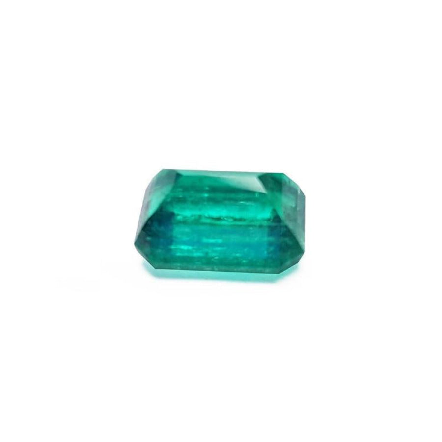 Vibrant bluish-green 4.18 carat emerald-cut loose emerald from Muzo, Colombia.