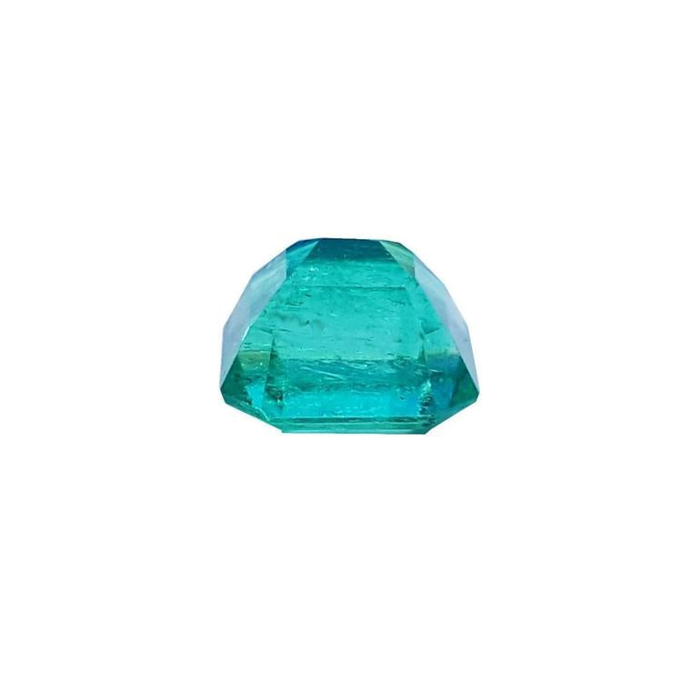 1.55 carat emerald-cut Muzo Colombian loose emerald, sparkling medium bluish green.