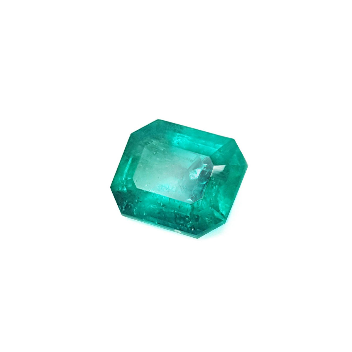 Emerald-cut loose Muzo colombian emerald 1.57 ct. front left side table and crown view