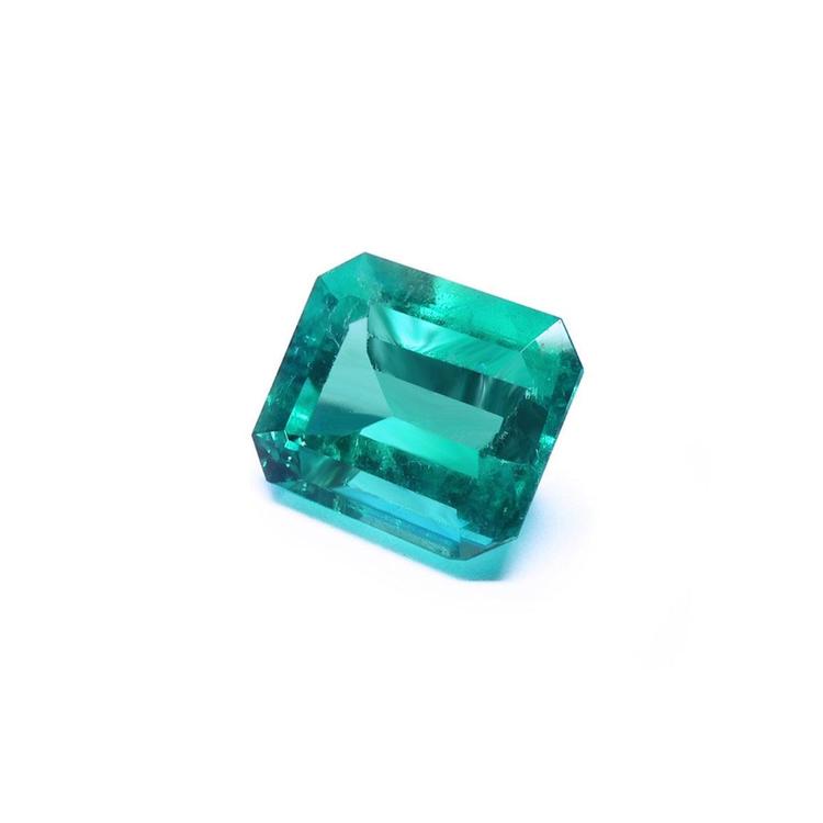 Gia certified emerald-cut loose Colombian emerald right side view displaying crown and table