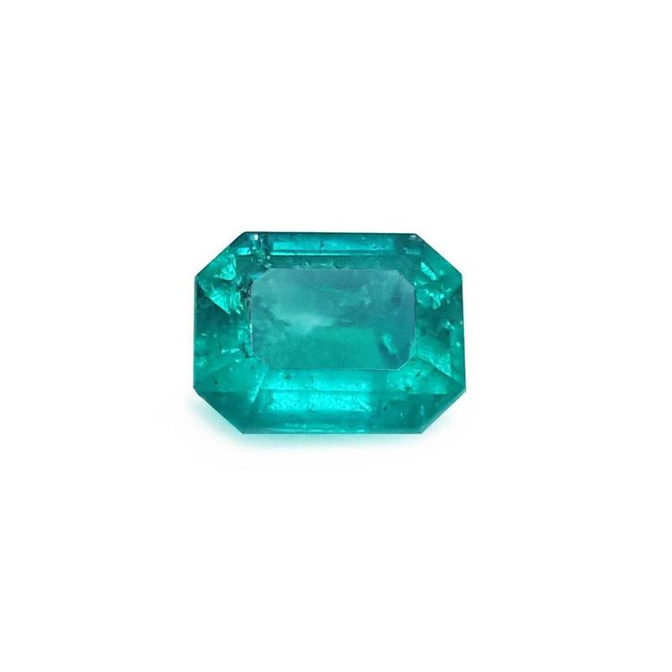 Emerald-cut loose Muzo colombian emerald 1.57 ct.  sparkling medium bluish green hue rectangular emerald cut.