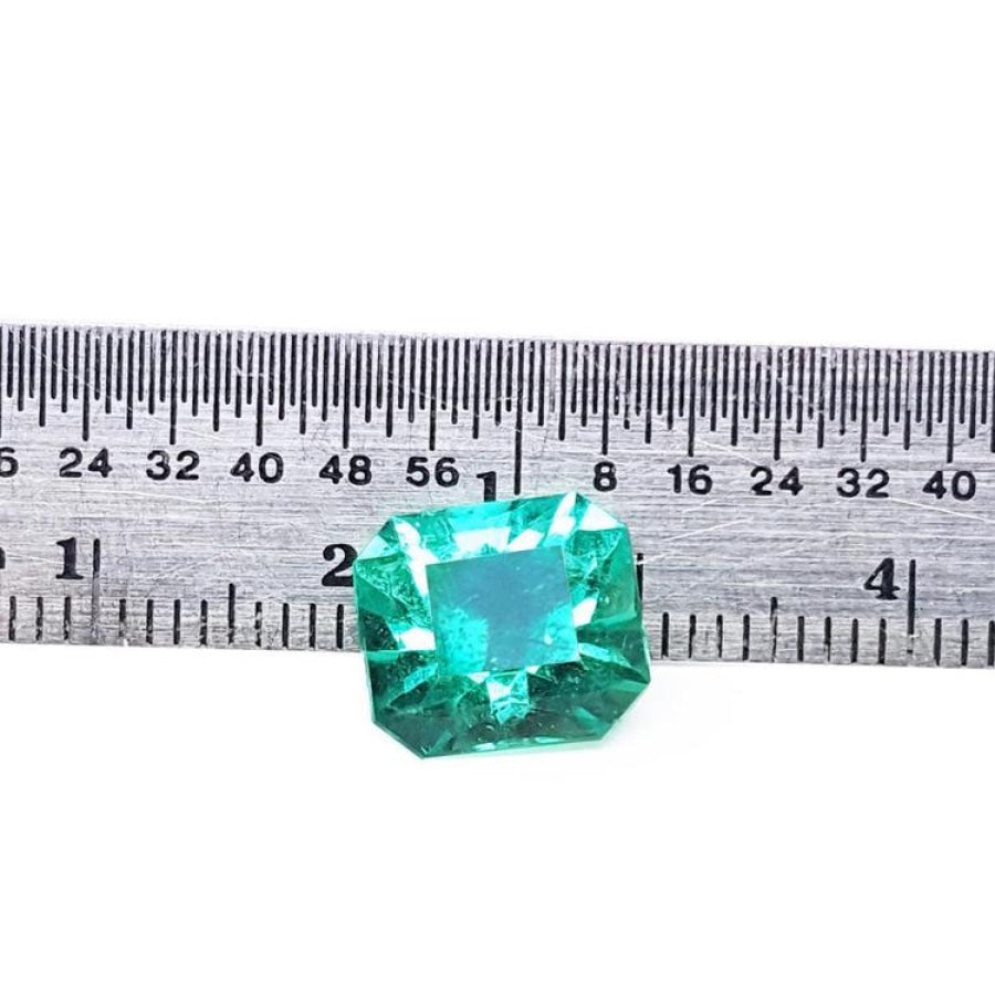 3.60 ct GIA certified loose Colombian emerald, medium bluish green, shown with a ruler.