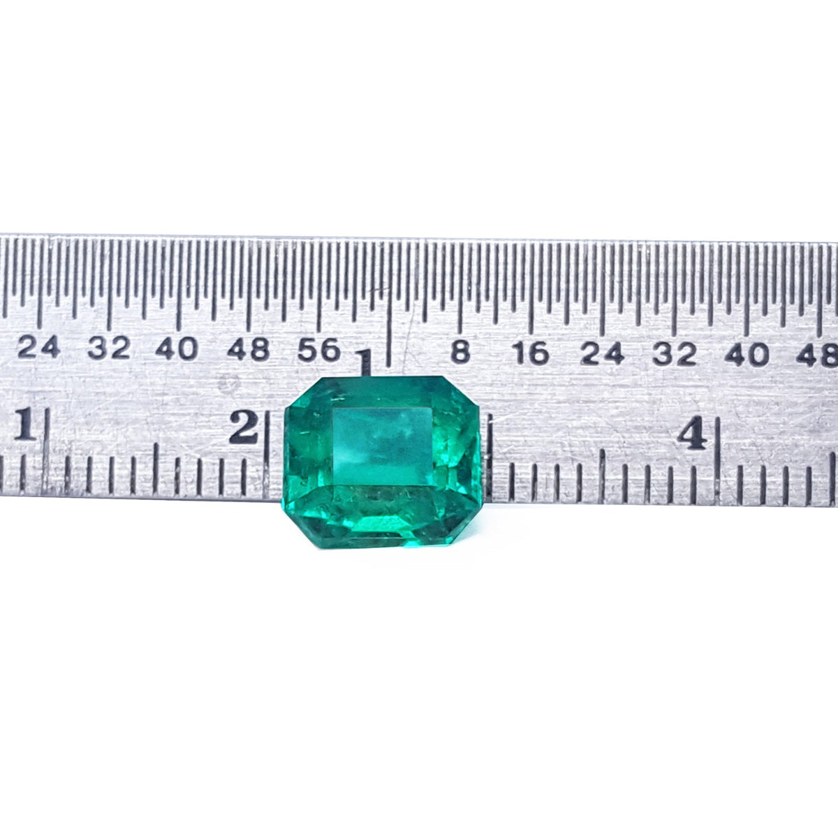 Emerald-cut 2.76 ct. Muzo mine loose emerald with ruler sizer