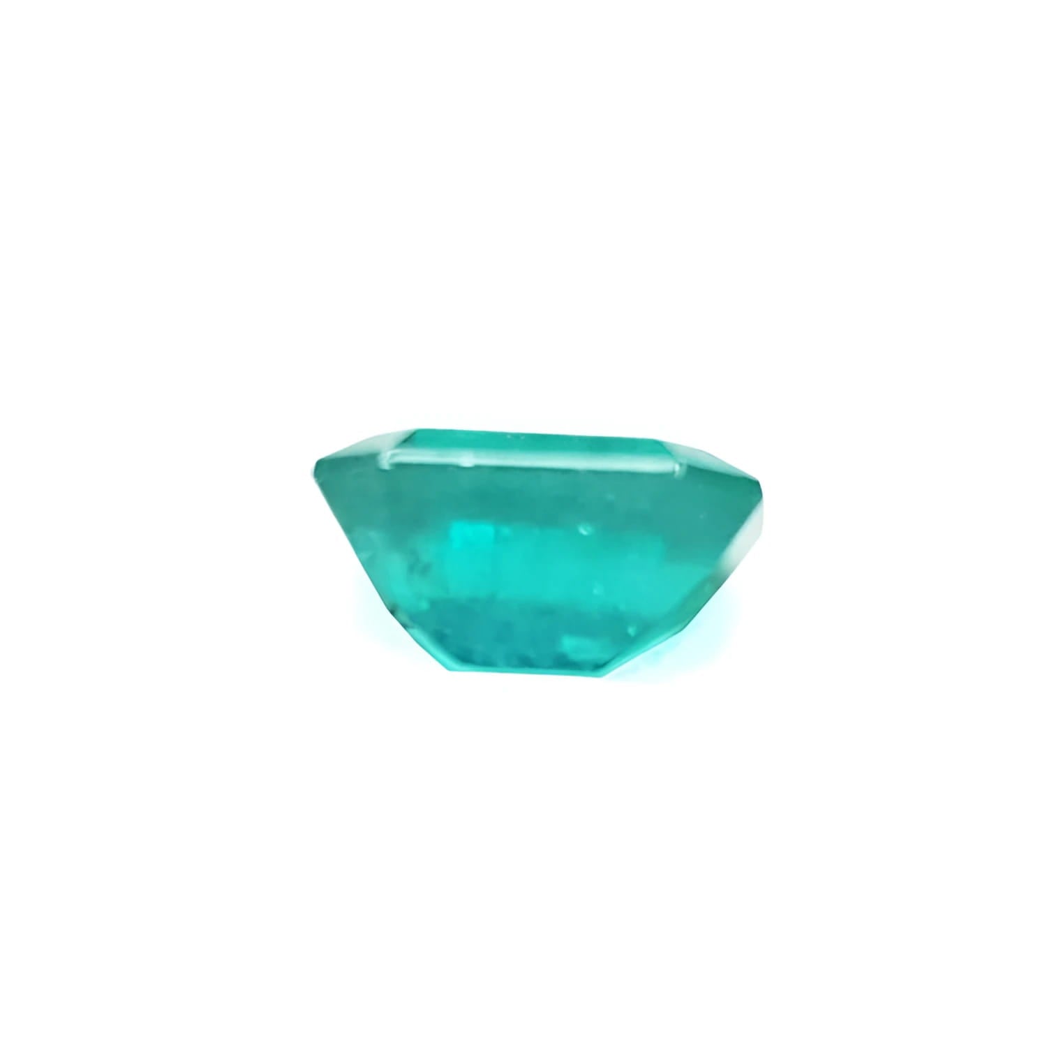 Sparkling 1.57 carat emerald-cut Muzo Colombian emerald with a medium bluish-green hue.