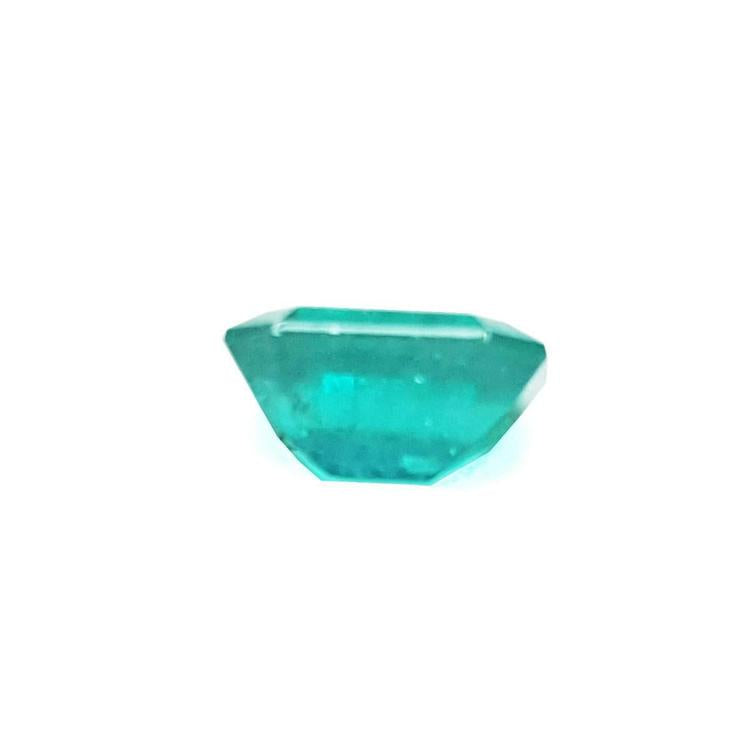 Sparkling 1.57 carat emerald-cut Muzo Colombian emerald with a medium bluish-green hue.