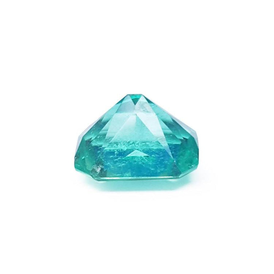 GIA certified 3.60 ct. loose Colombian emerald, medium bluish green, with visible inclusions.