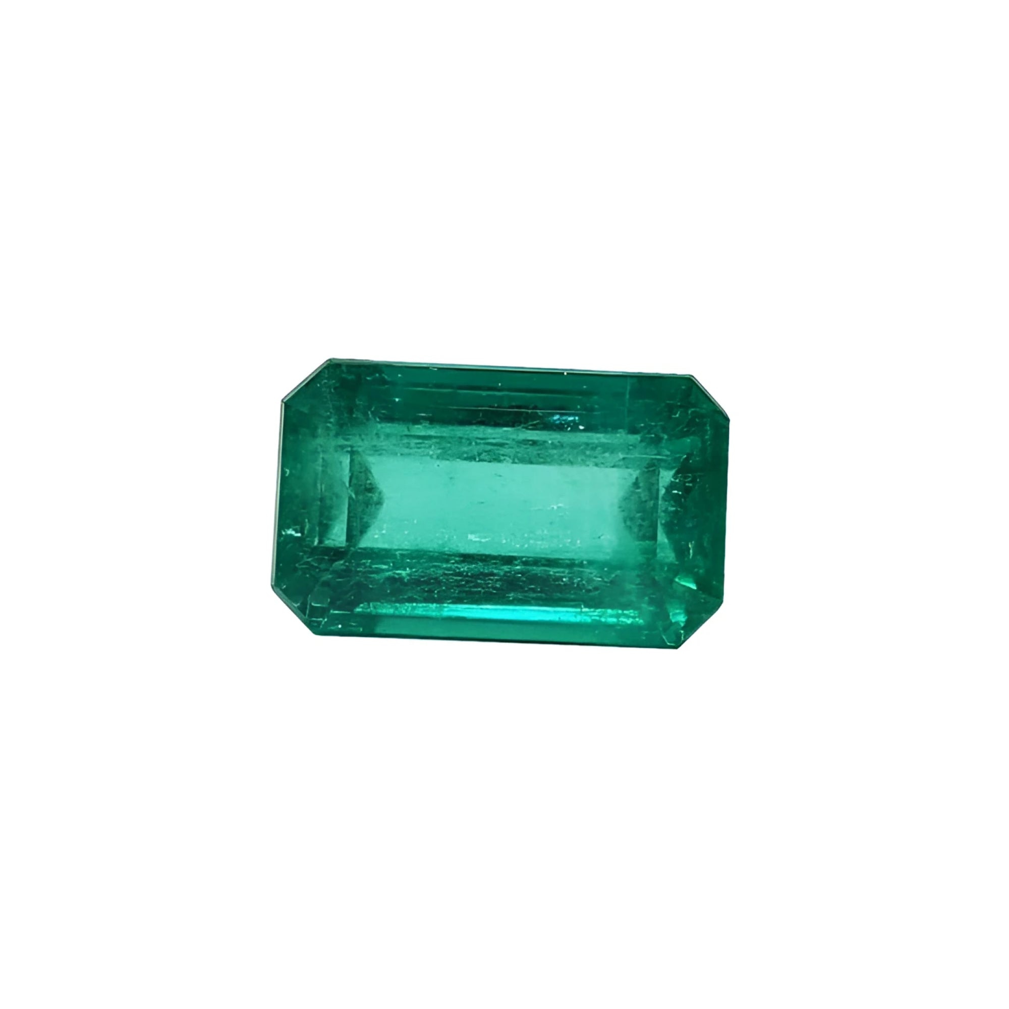 Emerald-cut natural loose colombian emerald, features a medium deep green hue and a rectangular emerald cut.