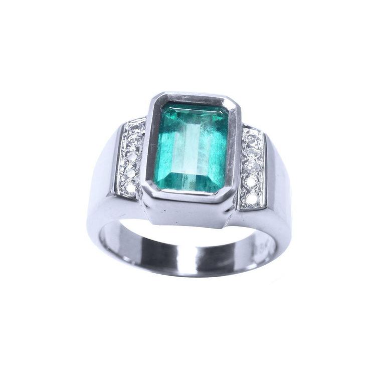 Men's 18K white gold ring with a bezel-set emerald-cut bluish-green emerald and side diamonds.