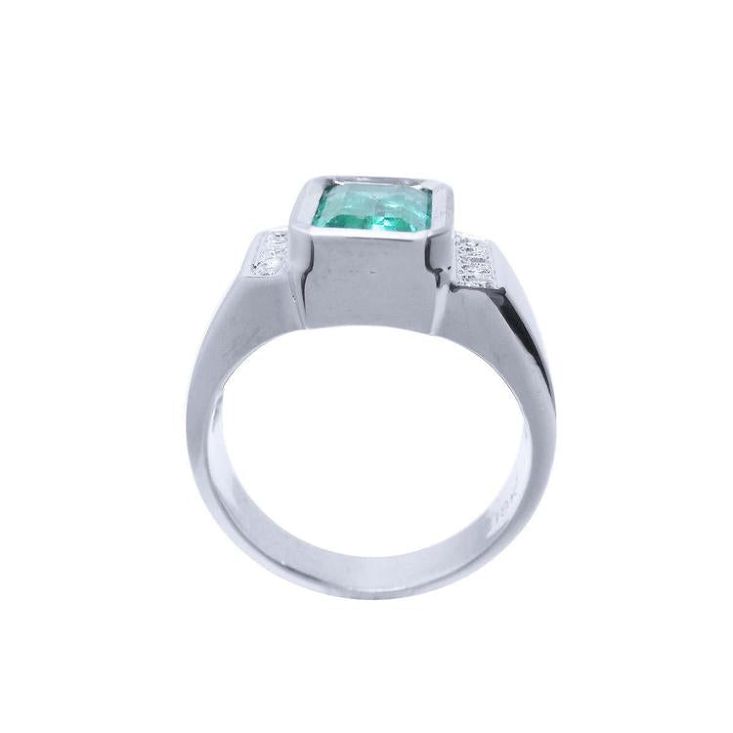 Men's 18K white gold ring with a bezel-set emerald-cut green emerald and diamond accents.