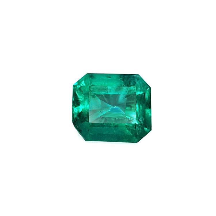 Emerald-cut loose natura colombian emerald very brilliant medium deep bluish green color.