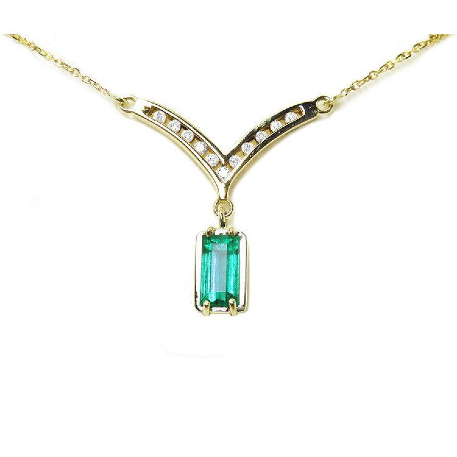 14K yellow gold necklace with a baguette-cut Colombian emerald and diamond-studded V-shaped pendant.