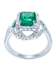 This 18k white gold natural emerald ring displays the top and gallery lateral side.