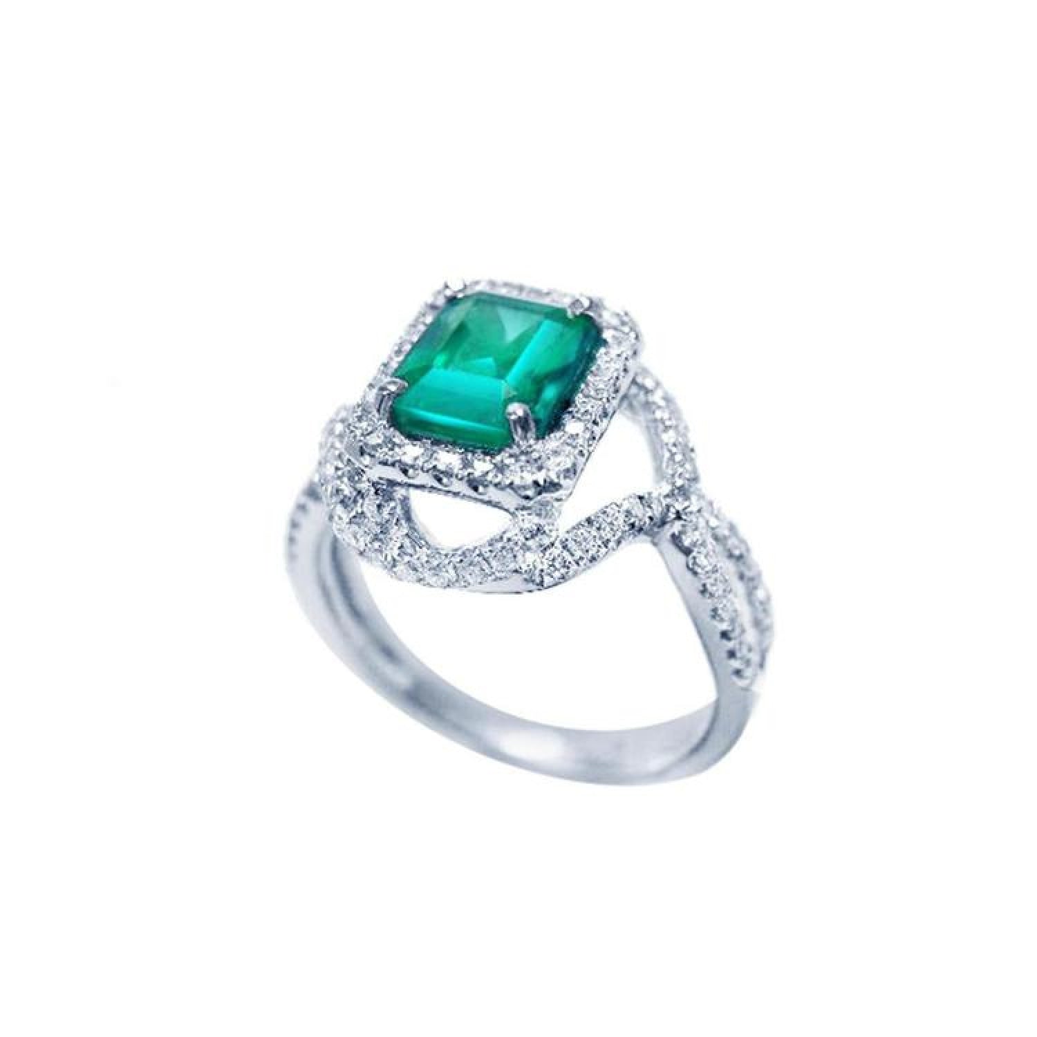 Emerald-cut natural emerald ring with halo diamonds and intertwined 18K white gold band.