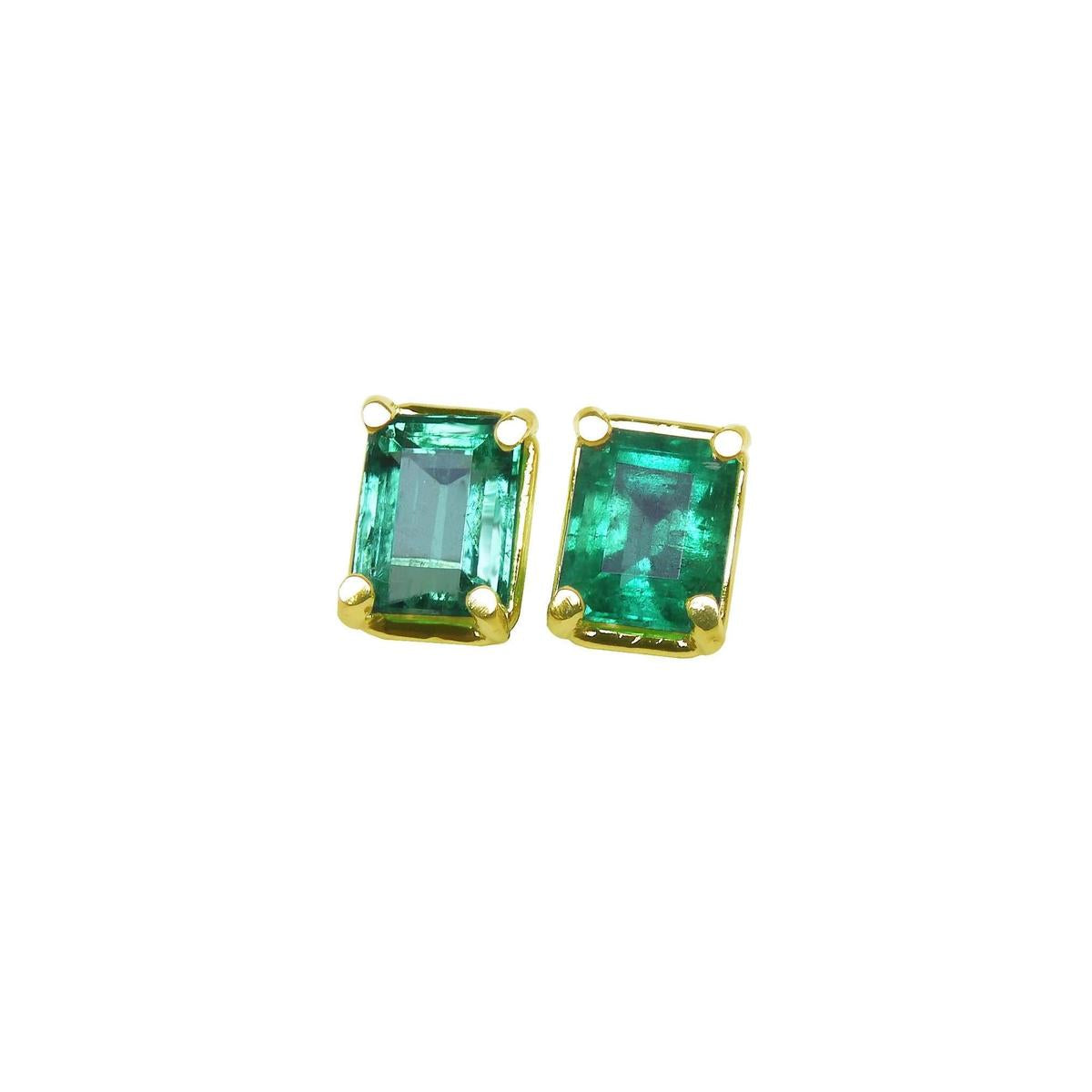 Pair of emerald-cut stud emerald earrings with yellow gold frames, front side top vie.