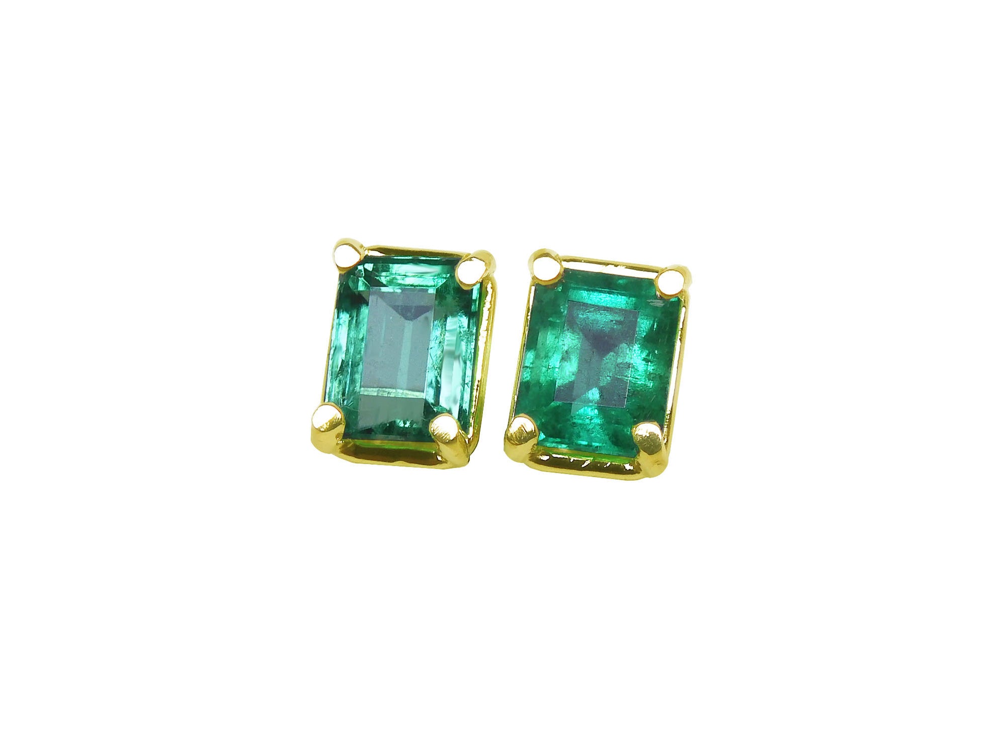 Pair of emerald-cut stud emerald earrings with yellow gold frames, front side top vie.