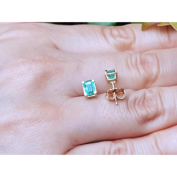 Emerald-cut natural Colombian emerald stud earrings, 1.29 ct, set in 14K yellow gold.