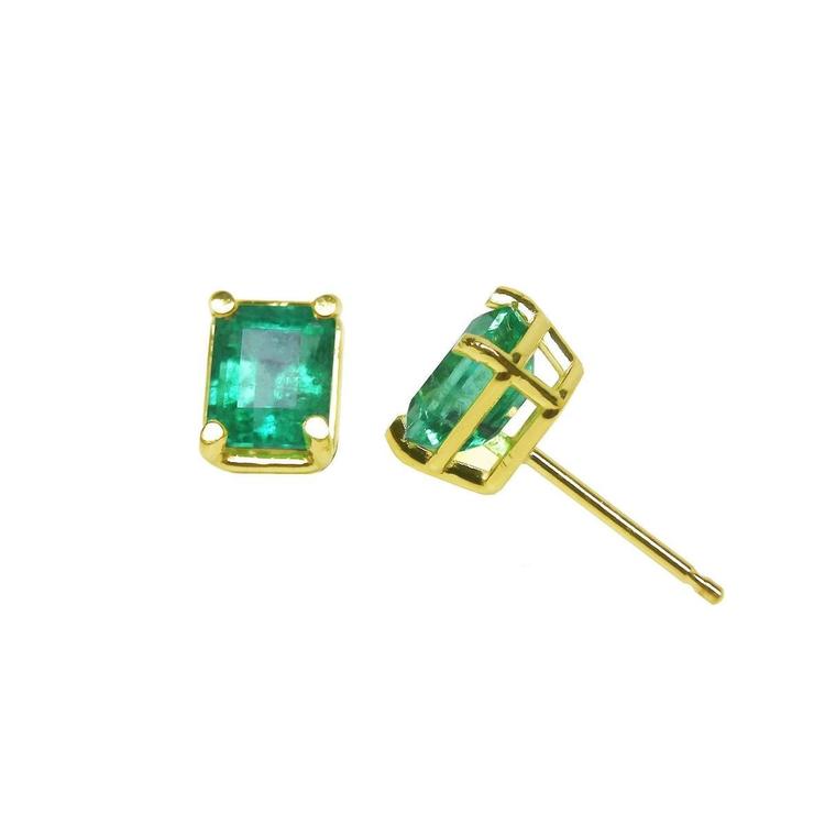 Emerald-cut natural emerald stud earrings, 1.29 ct, set in 14K yellow gold basket settings.