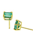 14k yellow gold emerald-cut emerald stud earrings on side positions profile view.