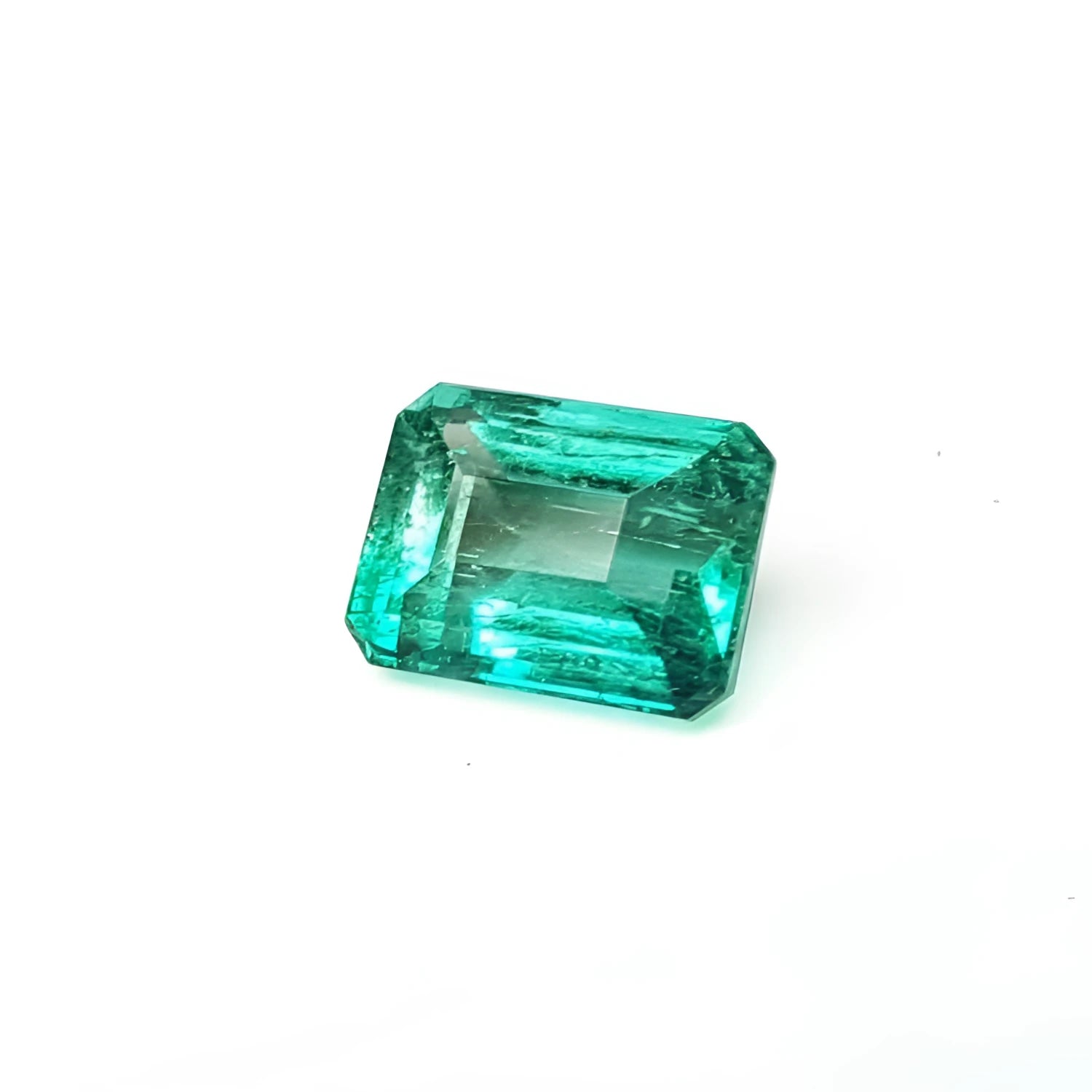 Affordable emerald-cut loose natural Colombian emerald.