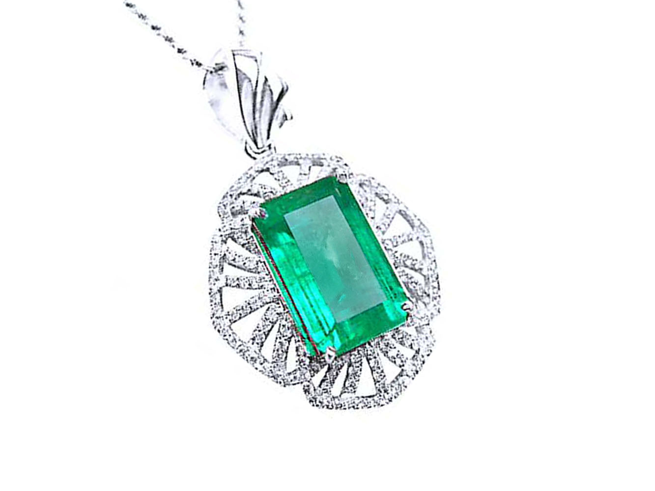 A natural colombian emerald-cut emerald pendant with diamond accents on a white gold design.