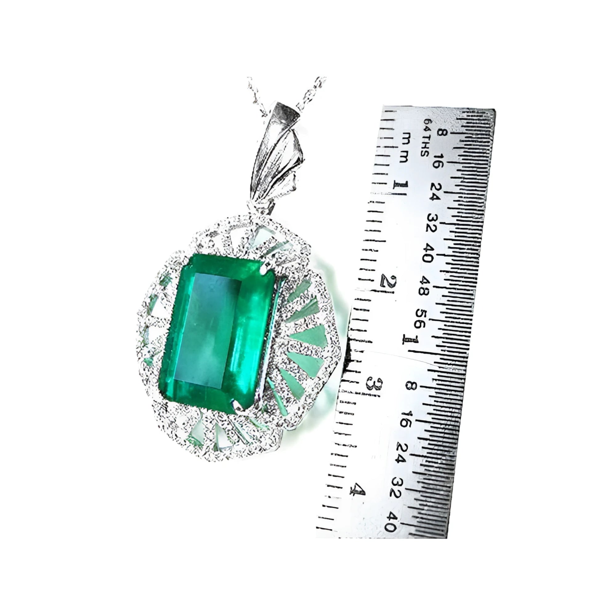 Emerald-cut Colombian emerald pendant with natural diamonds in 14K white gold, shown next to a ruler.