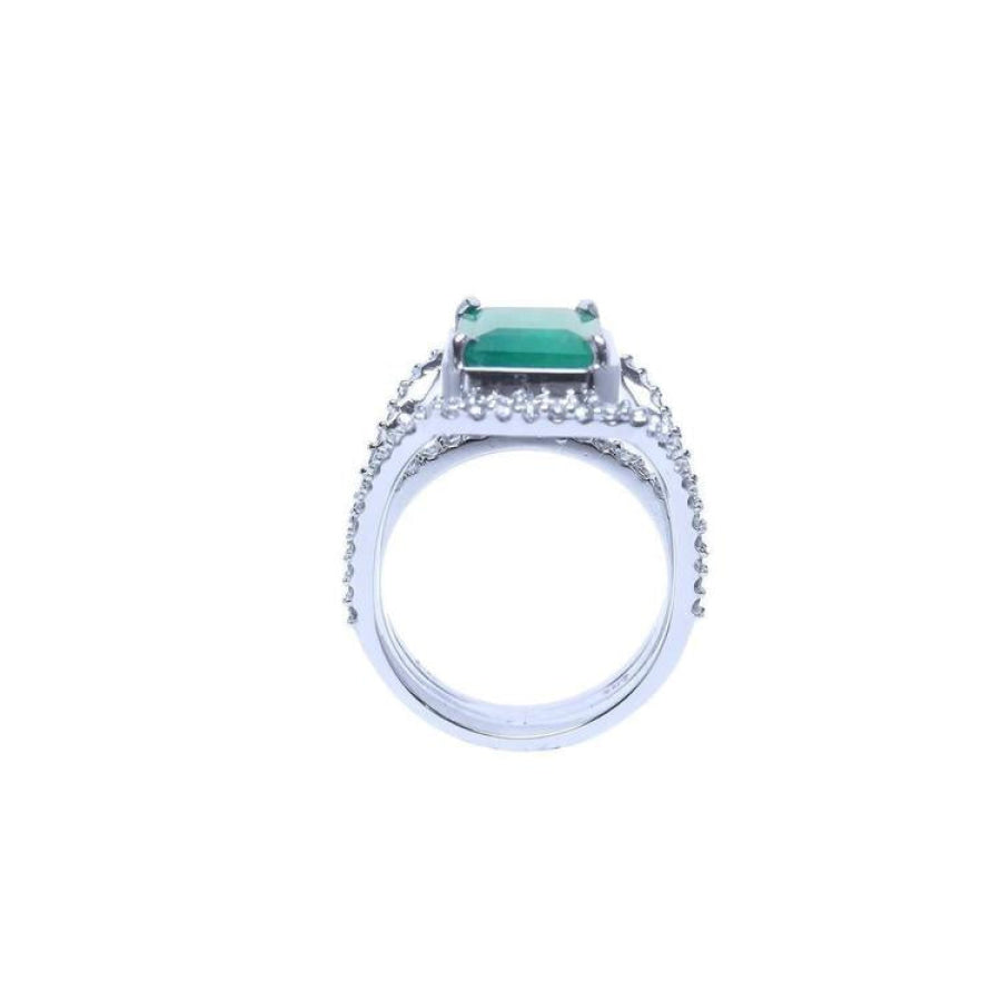 Emerald-cut 3.90 ct bluish-green natural emerald ring with triple row diamond band in 14K white gold.